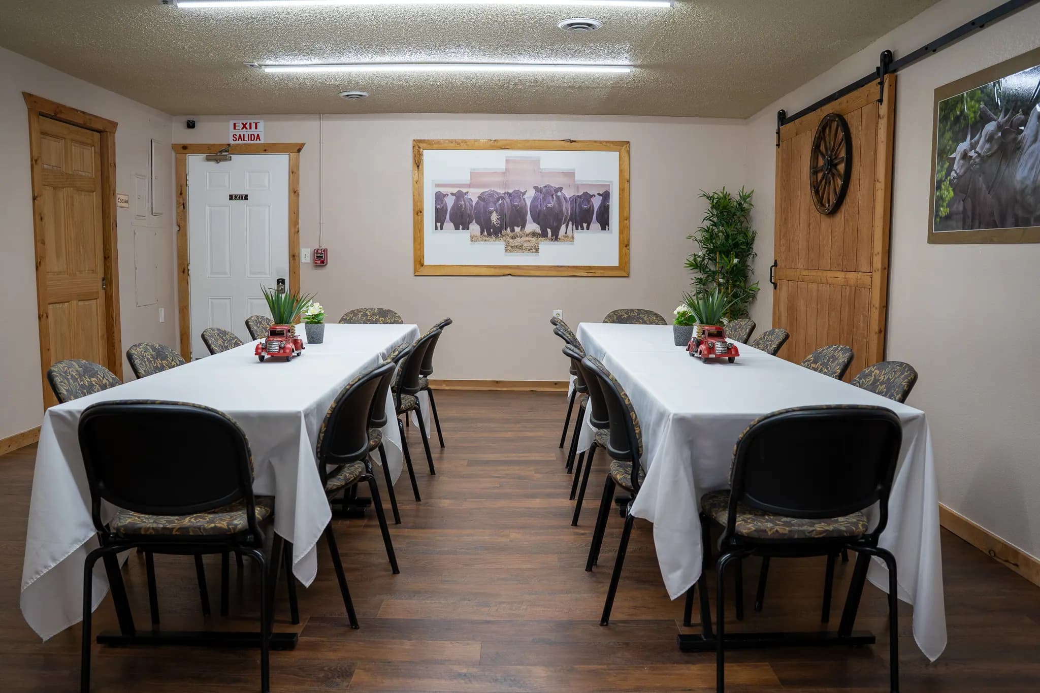 Boardroom arranged classroom-style near a rustic barn door