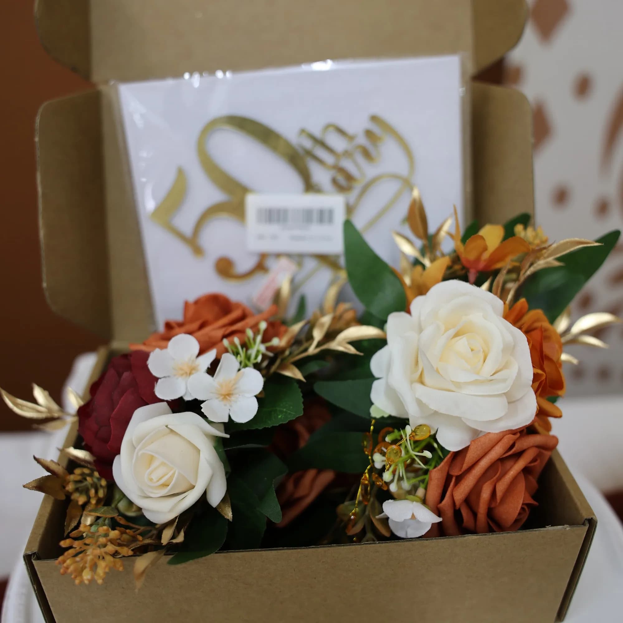 Floral centerpiece arrangement in rose gold and cream