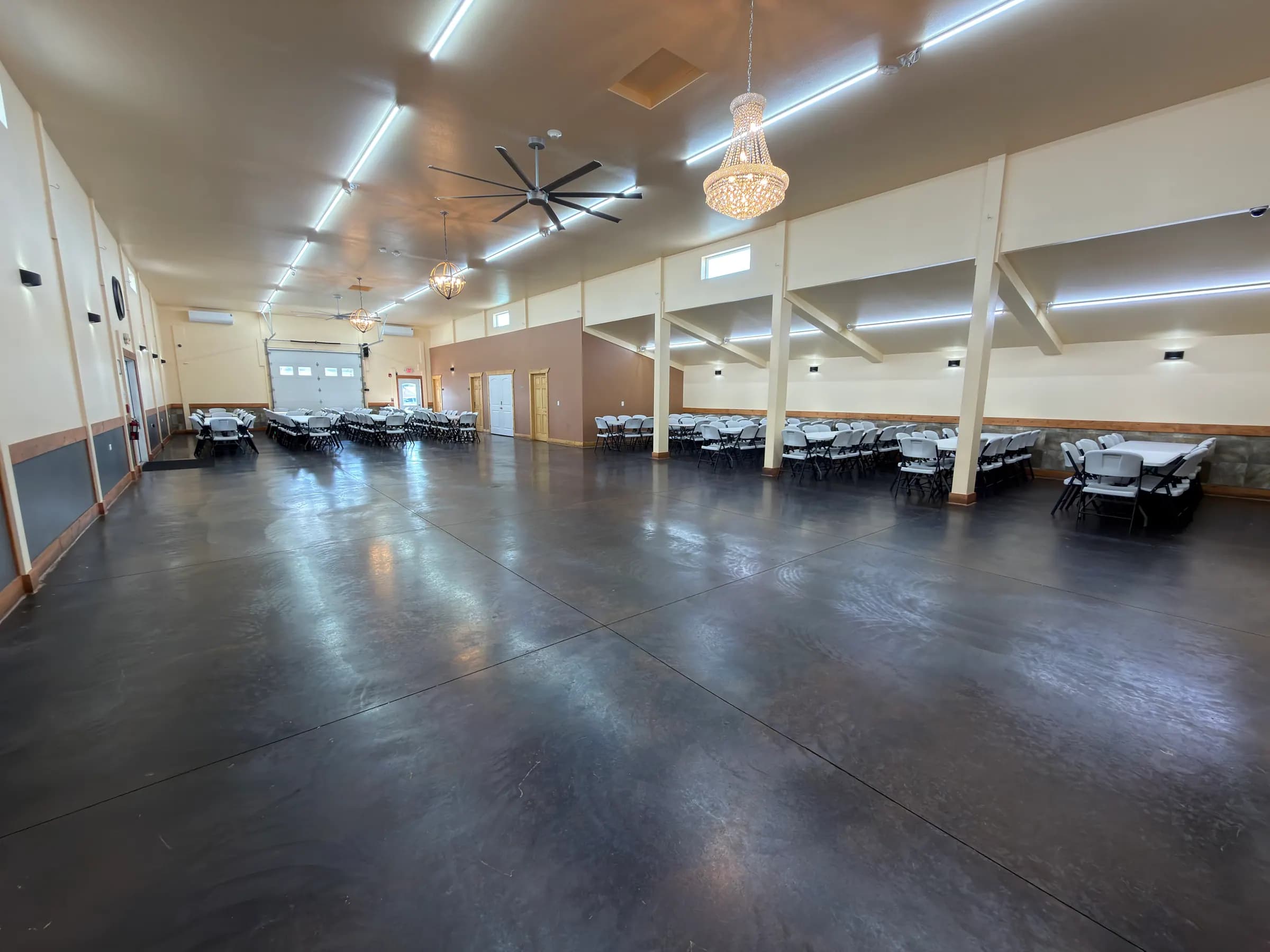 Grand Ballroom set with long tables and a crystal chandelier